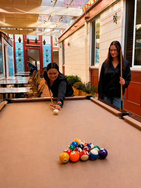 Happy hour bar and patio atmosphere at INDYA in Clairemont
