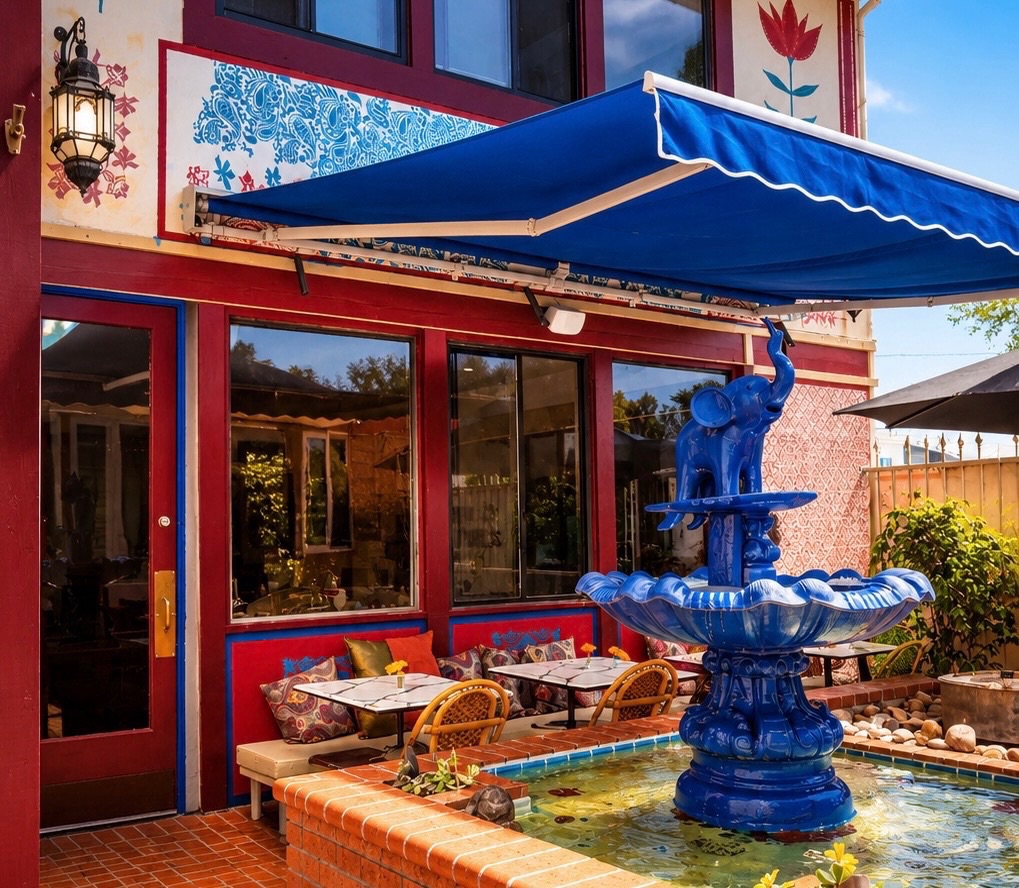Patio courtyard with blue fountain at INDYA Restaurant and Bar in San Diego